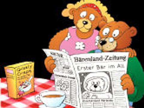 Bärenfamilie liest Zeitung; Titelzeile: Erster Bär im All