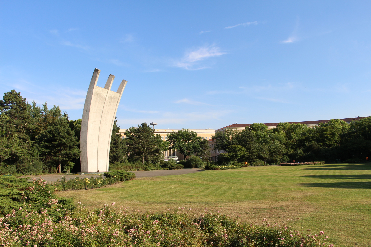a large monument on a leafy square