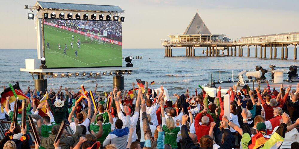 Public Screening: Spectators cheer at the public screening event by the water