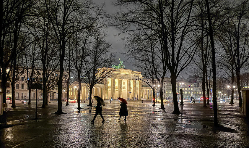 The Brandenburg Gate in winter during a rainstorm