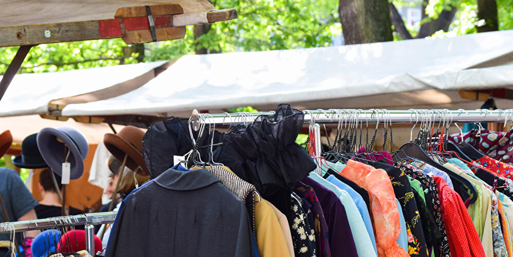 Second-hand clothes on a clothes rail