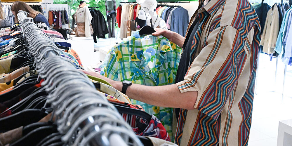 Secondhand clothing on a clothes rack
