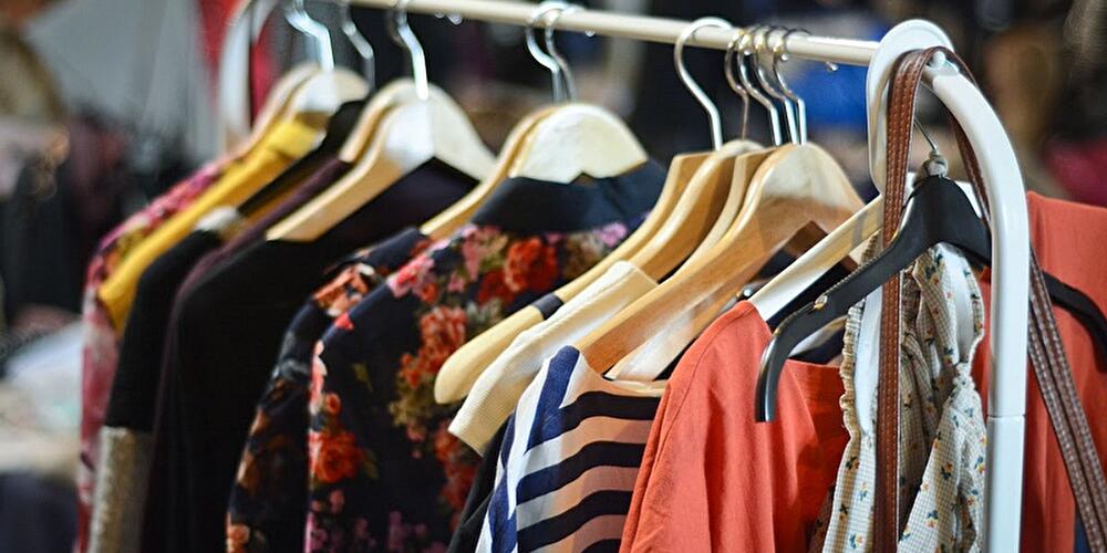 Secondhand clothing on a clothes rack