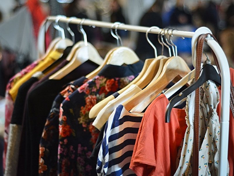 Secondhand clothing on a clothes rack
