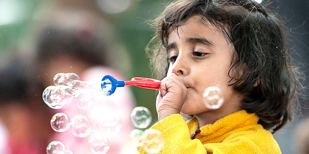 Kind mit Seifenblasen