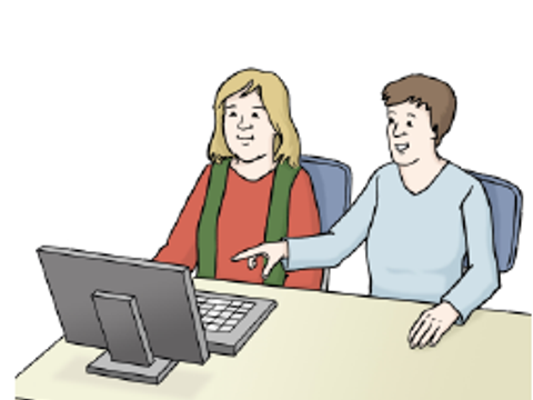 Zwei Personen sitzen am Arbeitsplatz