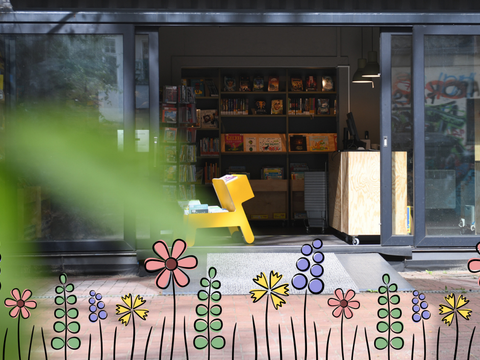Fotografie der Familienbibliothek Else Ury - Pop-Up Else mit einer illustrierten Blumenwiese