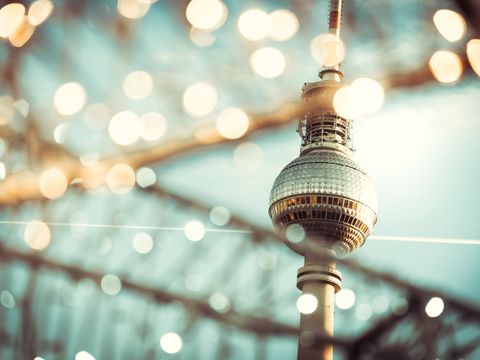 Berlin Tv-tower behind golden blurred lights
