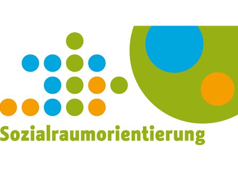 Bunte Punkte mit der Aufschrift: Sozialraumorientierung
