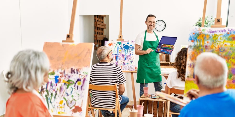 Group of middle age students having draw lesson at art studio.