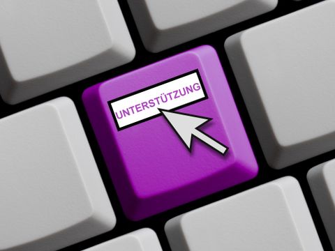 Computertastaturtaste mit Aufschrift 'Unterstützung' und Mauszeiger