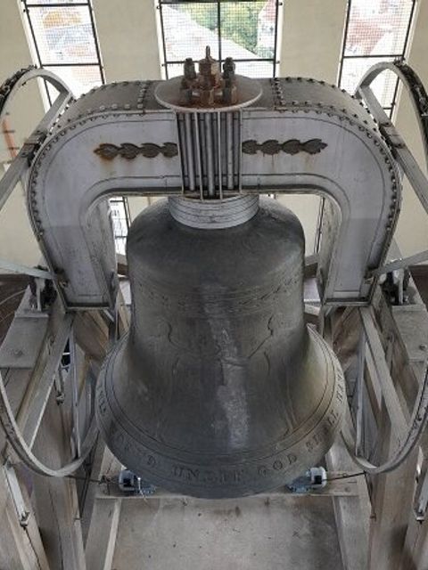 A large bell in a tower