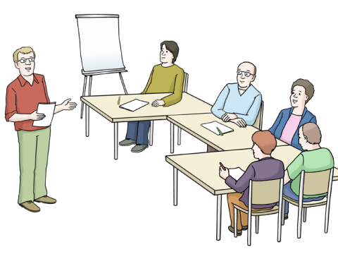 Kursteilnehmer und lehrende Person