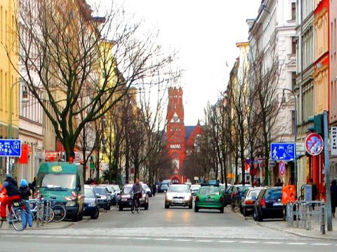 Wrangelstrasse in Berlin Kreuzberg, view from corner Lübbener Straße southeastwards to Protestant Tabor Church (Evangelische Taborkirche) with war-damaged tower stump