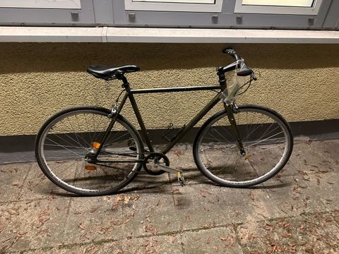 Gold-schwarzes Herrenfahrrad