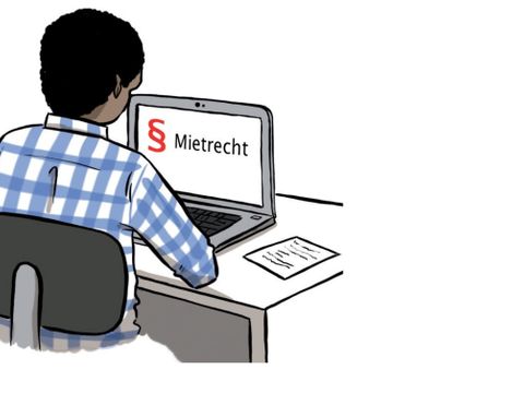 Mensch sitzt am Schreibtisch und arbeitet am Computer