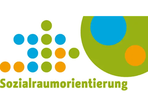 Bunte Punkte mit der Aufschrift: Sozialraumorientierung