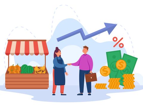 Small business owner shaking hands with money lender