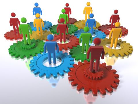 Multi colour cogs + 3D figures as a metaphor for a diverse team