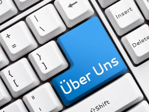 Tastatur mit blauer Taste Über uns