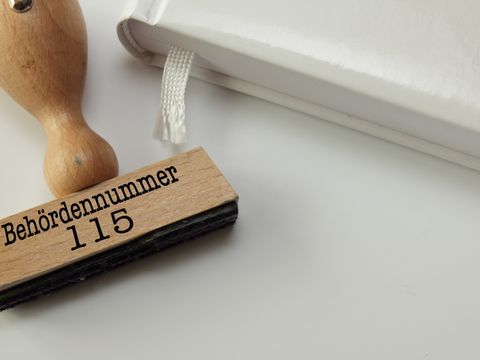 Stempel mit Behördenrufnummer 115