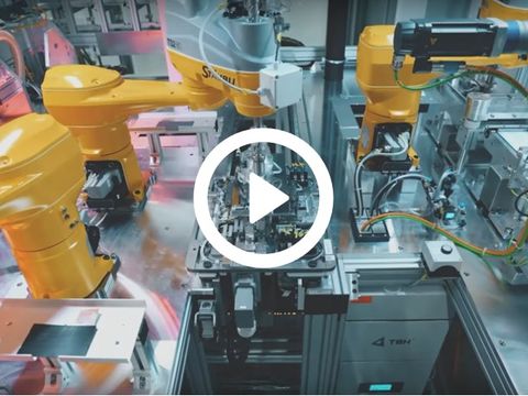 Videothumbnail mit orangenen Roboterarmen