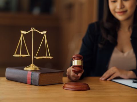 Asian lawyer woman working in a law office. Legal and legal service concept.