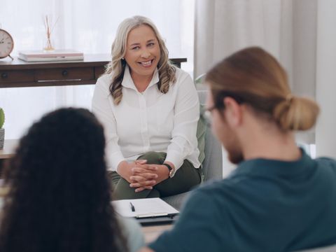 Therapy, marriage counseling and doctor with a couple together in a consulting office for communica