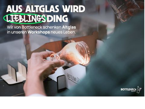 Foto: eine Hand hällt einen Flaschenkopf über einer Schleifmaschine