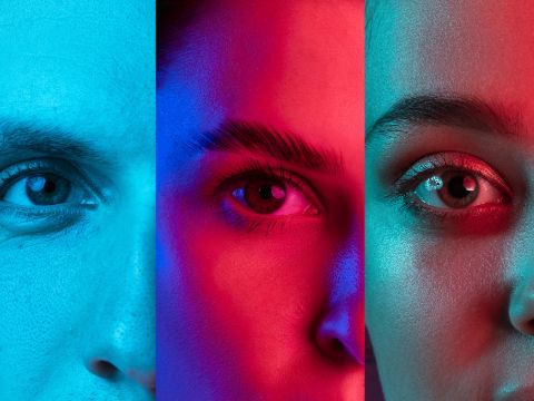 Augenpaare in drei Regenbogenfarben vertikal