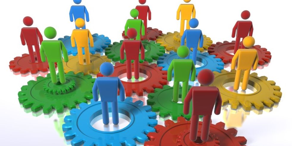 Multi colour cogs + 3D figures as a metaphor for a diverse team