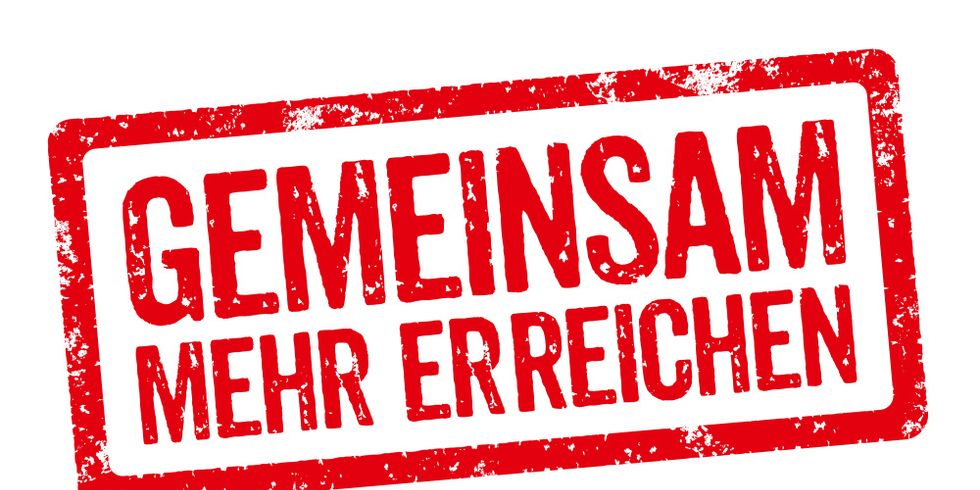 Roter Stempel mit der Aufschrift Gemeinsam mehr erreichen