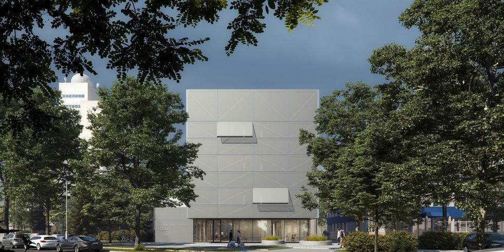 Ein futuritisch aussehendes graues Bauwerk in der Dämmerung