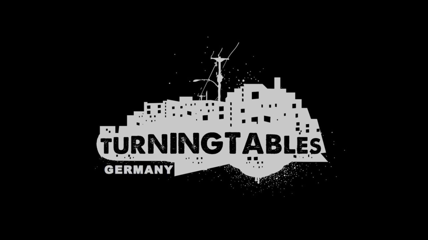 Logo mit Häuseransicht und Schriftzug Turning Tables Germany
