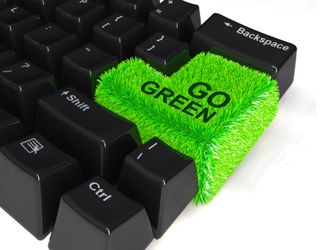 keyboard with enter button in green grass