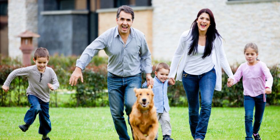 Family running with dog
