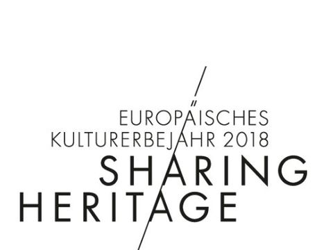 Schwarzer Schriftzug Sharing Heritage auf weißem Untergrund