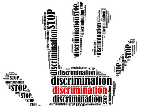 Hand mit Schrift Stop discrimination