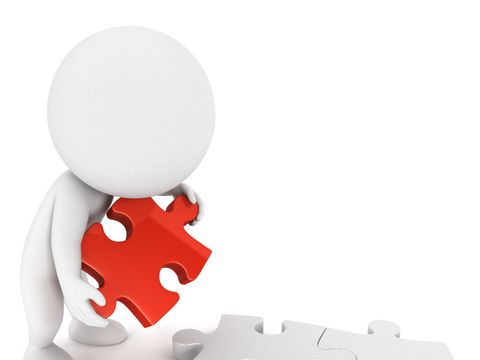 Abstrakte Figur mit einem roten und zwei weißen Puzzleteilen