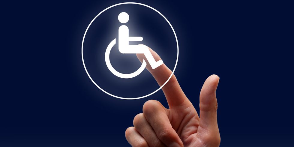 Zeigefinger berührt Symbol für Zugangsmöglichkeit für behinderte Menschen