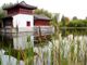 Gärten der Welt - Chinesischer Garten - außen - Steinboot im Wasser - Vordergrund Schilf