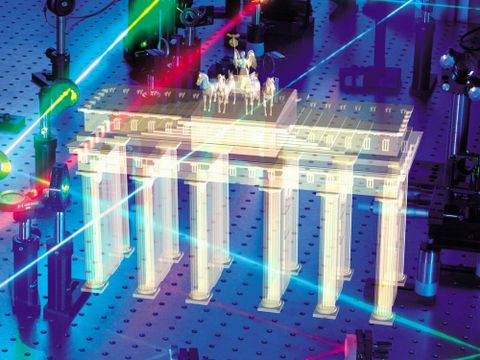 A hologram of the Brandenburg Gate with laser beams